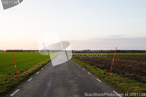 Image of Country road with snow spokes