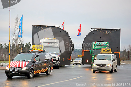 Image of Pilot Cars and Two Trucks Hauling Oversize Loads