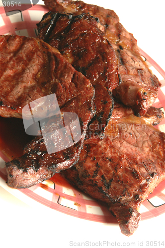 Image of four rib eyes