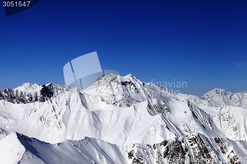 Image of Snowy mountains in sun day