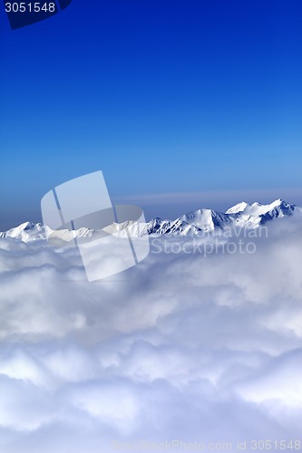 Image of Cloudy mountains at nice winter day