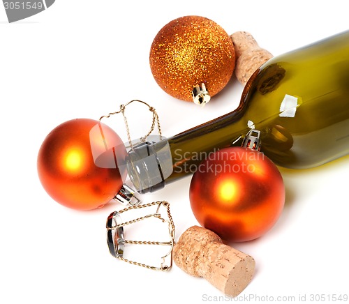 Image of Empty bottle of wine, corks, muselets and Christmas decorations