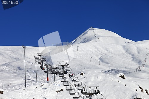 Image of Winter mountains and ski slope at nice sun day