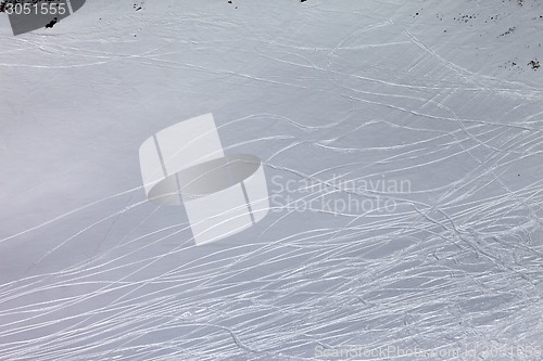 Image of Off-piste slope with traces of skis and snowboards