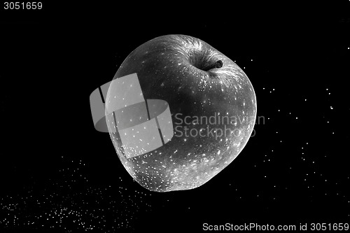 Image of Small apple in see trough water