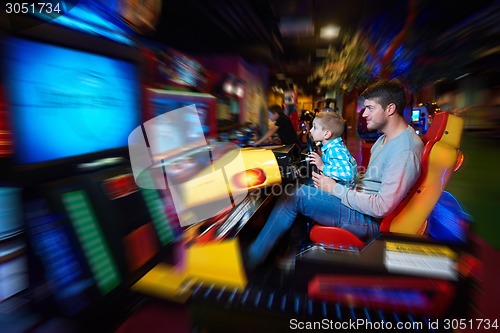 Image of father and son playing game in playground