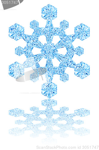 Image of Light blue crystal snowflake on glossy white background