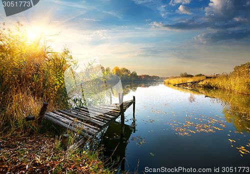 Image of Old pier on autumn river