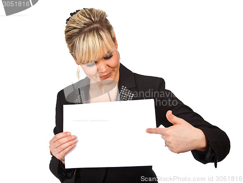 Image of Studio portrait of a cute blond girl holding a piece of paper