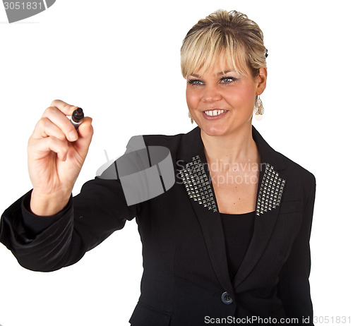 Image of Studio portrait of a cute blond girl writing on a transparent wa