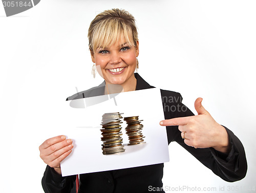 Image of Studio portrait of a cute blond girl holding a piece of paper