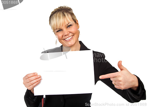 Image of Studio portrait of a cute blond girl holding a piece of paper