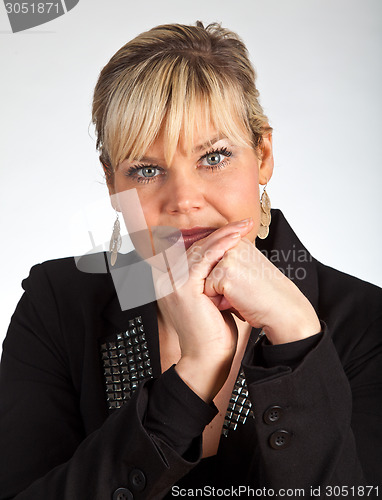 Image of Studio portrait of a cute blond girl looking in front of her