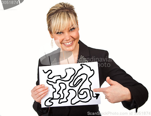 Image of Studio portrait of a cute blond girl holding a piece of paper
