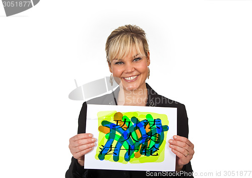 Image of Studio portrait of a cute blond girl holding a piece of paper