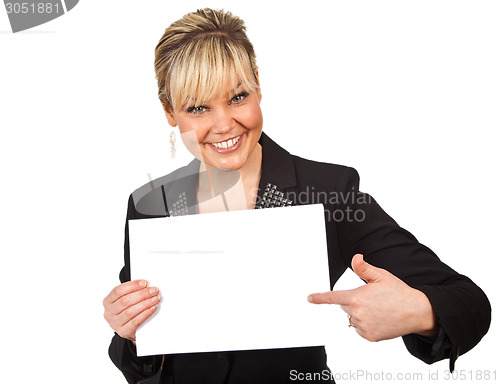 Image of Studio portrait of a cute blond girl holding a piece of paper