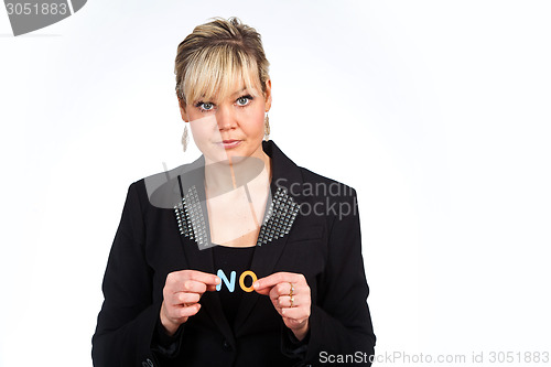 Image of Studio portrait of a cute blond girl holding two letters forming