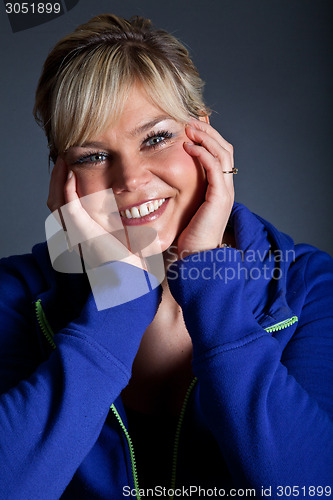 Image of Studio portrait of a cute happy blond girl