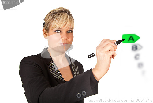 Image of Studio portrait of a cute blond girl writing on a transparent wa