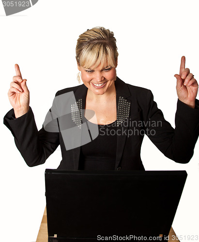 Image of Studio portrait of a cute blond girl with a computer hands up