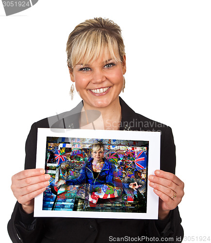 Image of Studio portrait of a cute blond girl holding a piece of paper