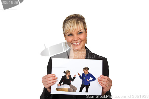 Image of Studio portrait of a cute blond girl holding a piece of paper