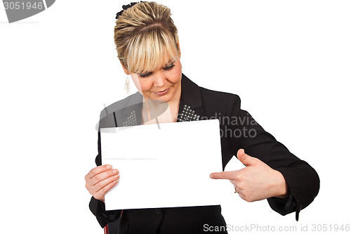 Image of Studio portrait of a cute blond girl holding a piece of paper