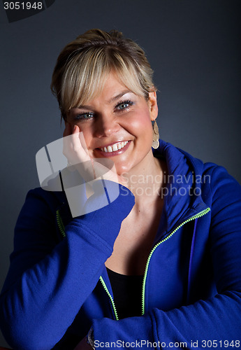 Image of Studio portrait of a cute happy blond girl