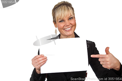Image of Studio portrait of a cute blond girl holding a piece of paper