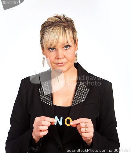 Image of Studio portrait of a cute blond girl holding two letters forming