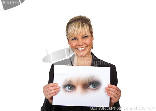 Image of Studio portrait of a cute blond girl holding a piece of paper