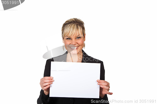Image of Studio portrait of a cute blond girl holding a piece of paper