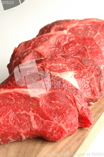 Image of four rib eyes