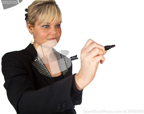 Image of Studio portrait of a cute blond girl writing on a transparent wa