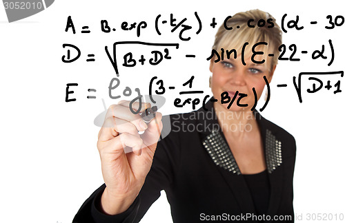 Image of Studio portrait of a cute blond girl writing on a transparent wa