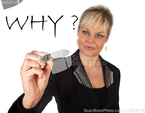 Image of Studio portrait of a cute blond girl writing on a transparent wa