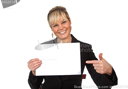 Image of Studio portrait of a cute blond girl holding a piece of paper
