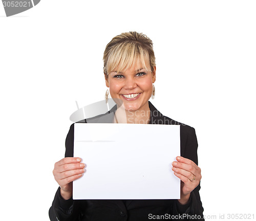 Image of Studio portrait of a cute blond girl holding a piece of paper