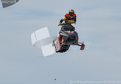 Image of High jump of sportsman on snowmobile