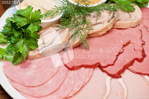 Image of meat, ham and sauce