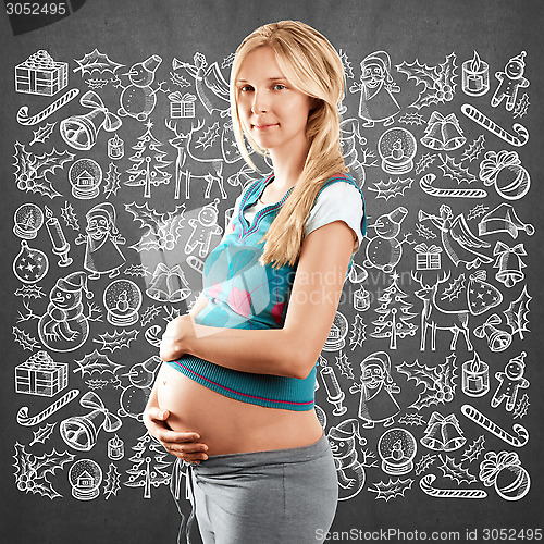 Image of Pregnant Woman Looking For Christmas Gifts