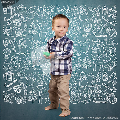 Image of Little Boy Looking For Christmas Gifts
