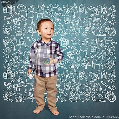 Image of Little Boy Looking For Christmas Gifts