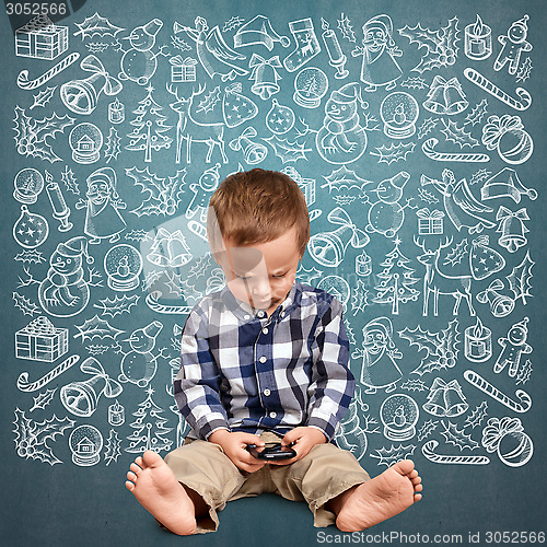 Image of Little Boy Looking For Christmas Gifts