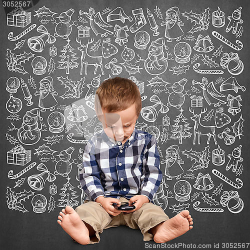 Image of Little Boy Looking For Christmas Gifts