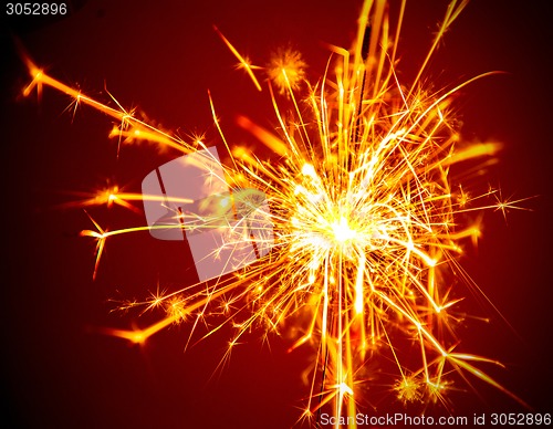 Image of sparkler on a dark background