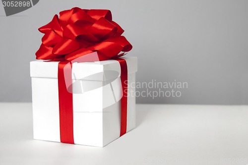 Image of gift box with red ribbon bow