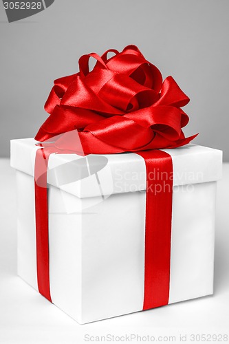 Image of gift box with red ribbon bow