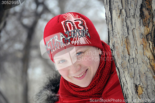 Image of The woman's portrait in a red jacket and a red cap