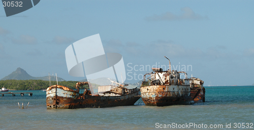 Image of two rotting tankers